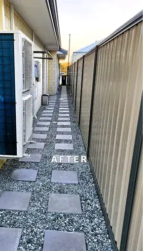 Side passage finished with gravel and pavers