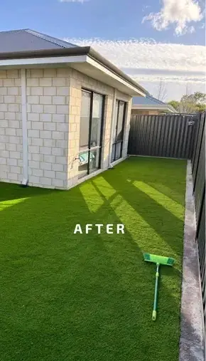 Side yard covered in artificial grass